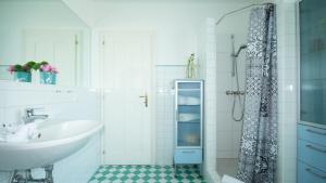 a bathroom with a sink and a shower at Appartements Resch in Schladming +28 photos