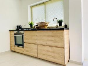 a kitchen with a sink and a counter top at Plemmirio Apartments in Siracusa
