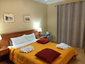 Postel nebo postele na pokoji v ubytování Guesthouse Lithos
