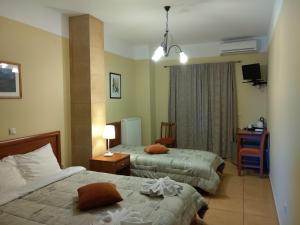 Postel nebo postele na pokoji v ubytování Guesthouse Lithos