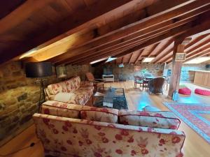 a living room with a couch and a table at Hotel Rural El Angel de la Guarda in Güemes