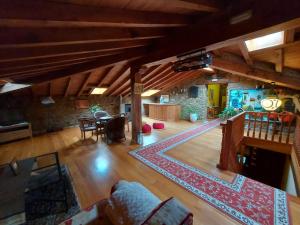an overhead view of a living room with a rug at Hotel Rural El Angel de la Guarda in Güemes