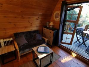 Χώρος καθιστικού στο Ma cabane au fond du jardin