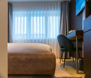 Voodi või voodid majutusasutuse Emery Hotel toas
