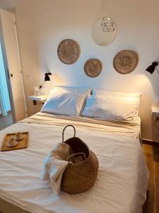 a bedroom with a bed with a basket on it at Agricampeggio La Piaggia - Agriturismo in Piombino
