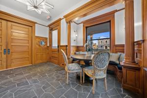 a dining room with a table and chairs at Beautiful Condo Steps from Shoreline Park - A in Sandusky