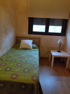 Łóżko lub łóżka w pokoju w obiekcie EL BALCÓN PANORÁMICO DE GREDOS