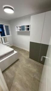 a bedroom with a bed and a sliding glass door at Mikel, oceanfront in Calafell