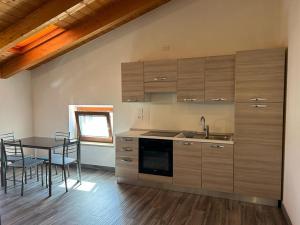 Kuchyň nebo kuchyňský kout v ubytování Le Murette Apartments - ENJOY HOLIDAY
