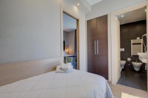Ένα ή περισσότερα κρεβάτια σε δωμάτιο στο Hotel Aiglon