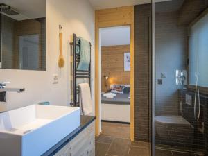 a bathroom with a sink and a shower at Apartment Plein Soleil A 9 by Interhome in Ovronnaz +18 photos