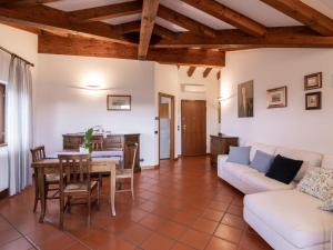 a living room with a couch and a table at Apartment Casa Monte Nero by Interhome in Cividale del Friuli