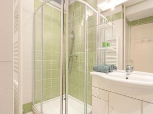 a bathroom with a shower and a sink at Apartment France by Interhome in Nice