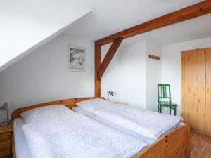a bedroom with a bed with a wooden frame at Apartment von Dollen-2 by Interhome in Oberndorf