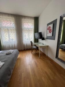 TV a/nebo společenská místnost v ubytování Dolce Vita Suites Boutique
