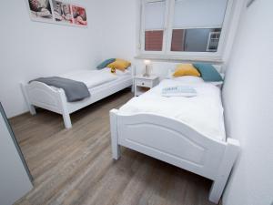 Tempat tidur dalam kamar di Apartment Leuchtturm by Interhome