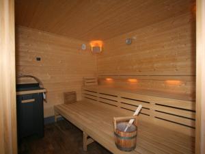 a sauna with a wooden bench and a sink at Apartment Erzherzog's Apts-Zillertal Alpen Lodge by Interhome in Uderns