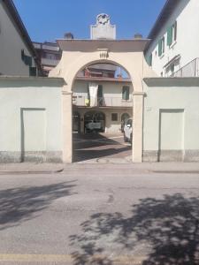 an entrance to a building with a parking lot at Dreaming Borgo Roma Apartment in Verona