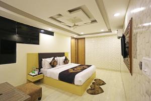 Voodi või voodid majutusasutuse Hotel D'Capitol - Delhi Airport toas