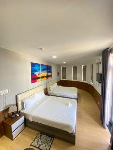 Postel nebo postele na pokoji v ubytování HAPPY HOTEL Tp Rạch Giá, Kiên Giang