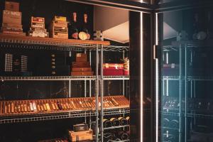 a room filled with lots of bottles of wine at Villa Sonnenhof Boutique-Hotel in Bad Reichenhall