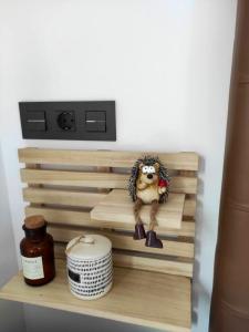 a wooden shelf with a statue of a cow on it at Studio with furnished terrace at Riogordo in Ríogordo