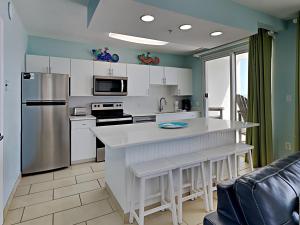 a kitchen with white cabinets and a counter top at Silver Beach 506 orange Beach in Orange Beach
