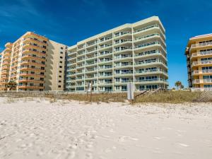 a building on the beach next to the beach at Silver Beach 506 orange Beach in Orange Beach