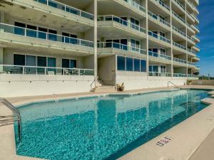 a large swimming pool in front of a building at Silver Beach 506 orange Beach in Orange Beach