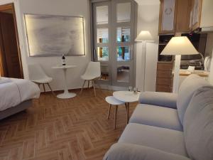 a living room with a couch and a table at Studio Apollonia in Alexandroupoli