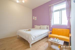 A bed or beds in a room at 四季逗庭園民宿-All Around the Seasons B&B