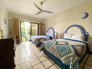 Postel nebo postele na pokoji v ubytování Puerto de Luna Pet Friendly and Family Suites