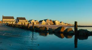 a group of houses on the shore of a beach at DUNE Fairfield Beach in Fairfield