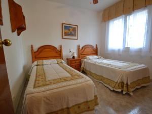 Posteľ alebo postele v izbe v ubytovaní Apartment Village Park 2 by Interhome