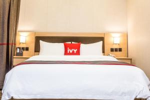 Postelja oz. postelje v sobi nastanitve Ivy Hotel Emerald