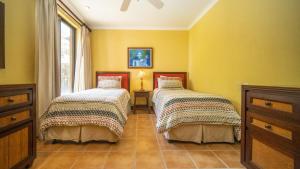 Voodi või voodid majutusasutuse Bougainvillea 1101 Luxury Apartment - Reserva Conchal toas