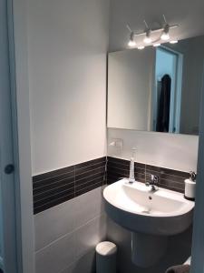 a bathroom with a sink and a mirror at [Portello] La casa di Andrea in Milan