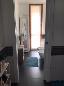 a bathroom with a toilet and a sink at [Portello] La casa di Andrea in Milan