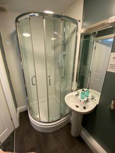 a bathroom with a shower and a sink at Ambleside Central in Ambleside