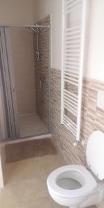 a bathroom with a toilet and a shower at Cummersa dell'alba in Locorotondo +23 photos