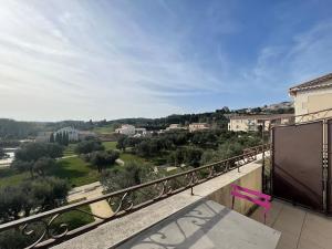 a balcony with a view of a city at Appartement Paradou vue magnifique in Paradou