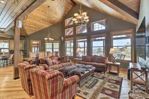 a large living room with couches and a table at Beautiful Eureka Cabin Rental on Golf Resort! in Eureka