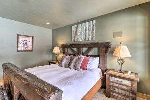 a bedroom with a wooden bed and two lamps at Beautiful Eureka Cabin Rental on Golf Resort! in Eureka