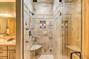 a shower with a glass door in a bathroom at Beautiful Eureka Cabin Rental on Golf Resort! in Eureka +28 photos