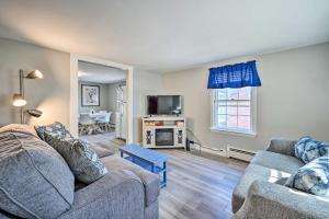 a living room with two couches and a tv at Lovely Rockport Apartment, Walk to Beaches! in Rockport