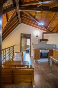a living room with a couch and a table at Villa Tuman Loutra Pozar Aridaias in Aridaia