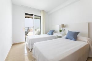 En eller flere senge i et værelse på AG Terranova + 39 billeder