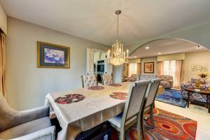 a dining room with a table and chairs at Spacious Buffalo Brick Home w/ Backyard! in Buffalo