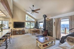 a living room with a couch and a table at Homey Colfax Getaway with Private Hot Tub! in Colfax