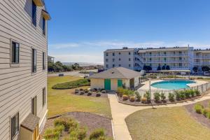 an aerial view of a building with a pool and a resort at Emerald Isle Vacation Rental with Resort Pool! in Emerald Isle